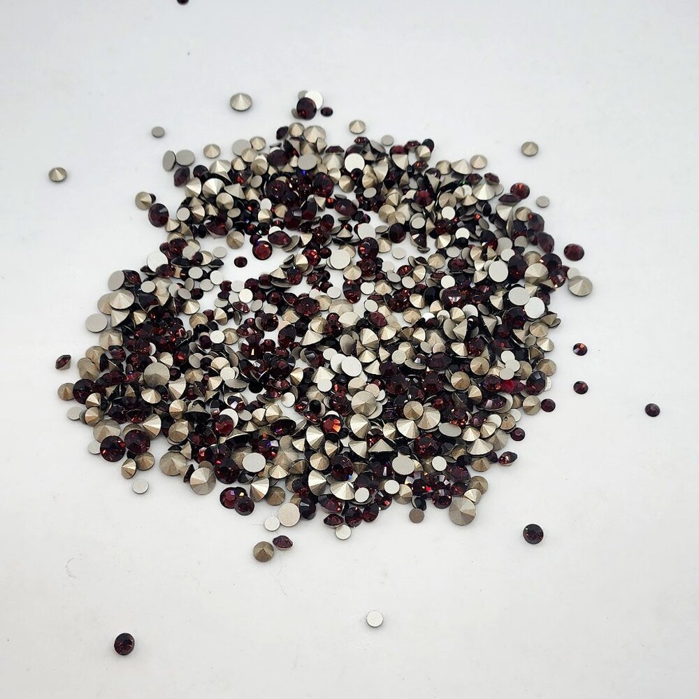 assorted loose burgundy swarovski rhinestones